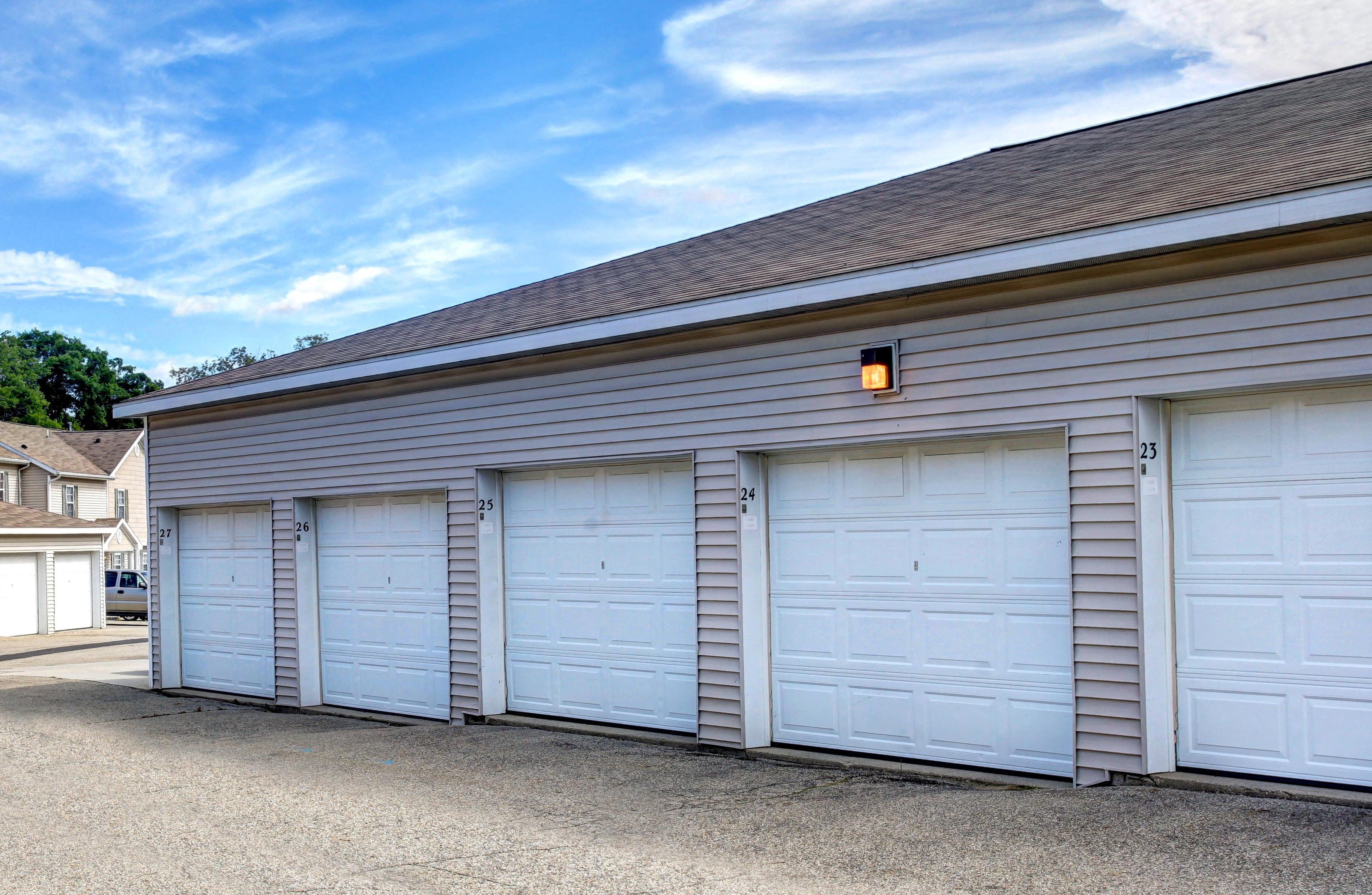 a white garage with three white garage doors