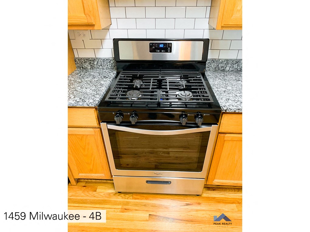 a stove top oven sitting on top of a kitchen