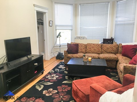 a living room with a couch and a tv