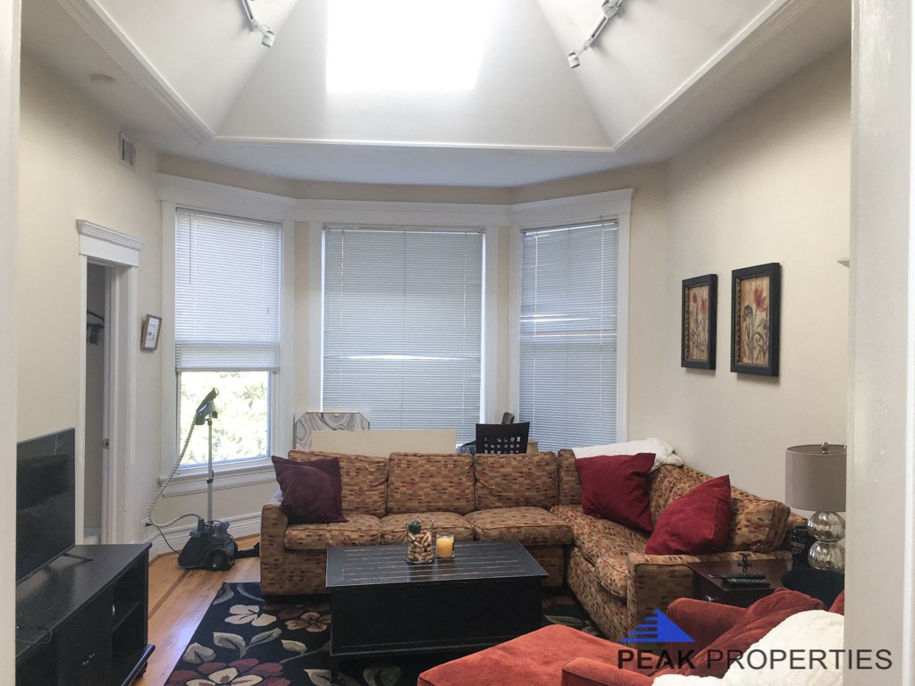 a living room with a couch and a tv