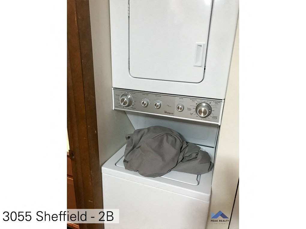 a hat is sitting on top of a washing machine