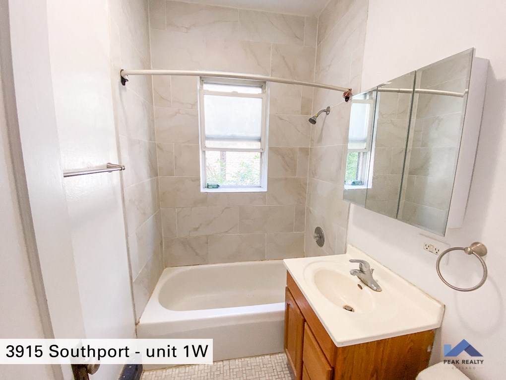 a small bathroom with a shower and a sink