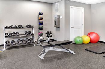 Free Weights In Gym at The Residences At Hanna Apartments, Cleveland, OH