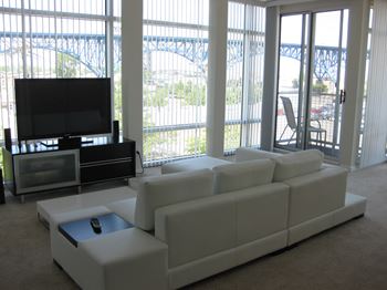 Floor-to-Ceiling Windows and Private Balcony Off of the Living Room