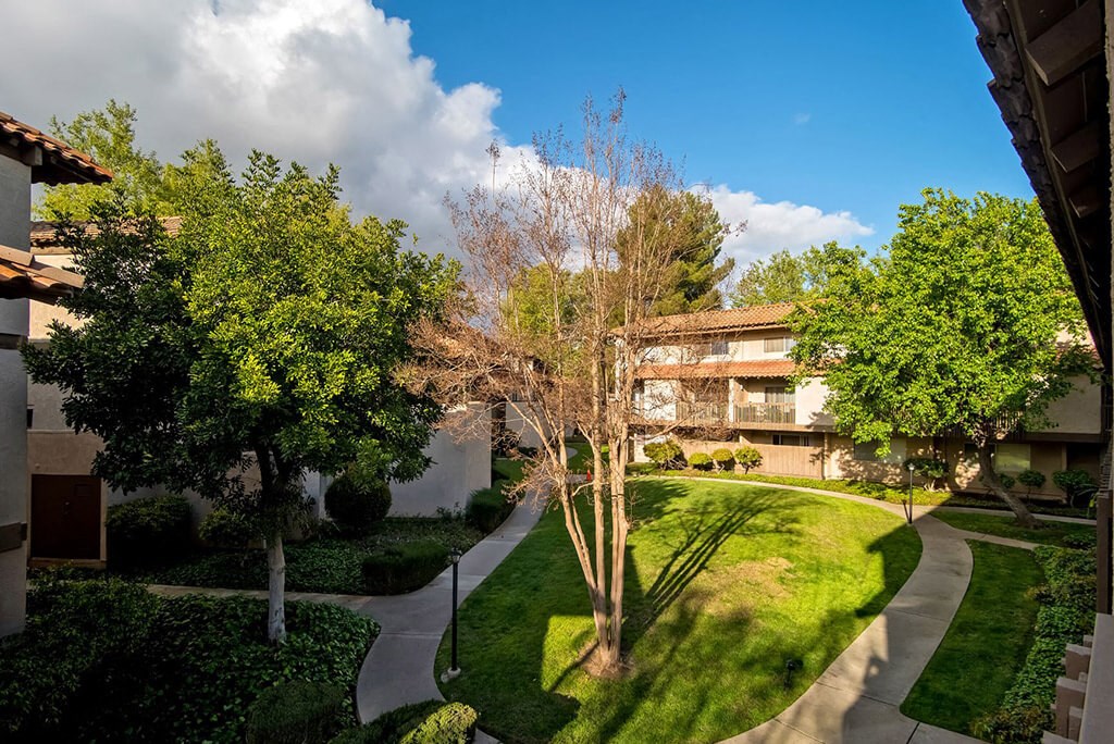 Property View With Mature Tree, cloud in sky at Wilbur Oaks Apartments, California, 91360