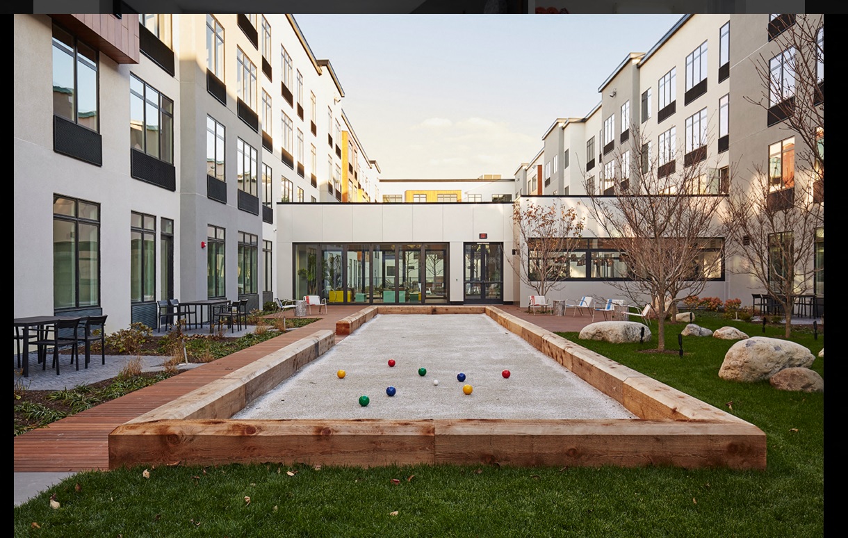 a pool with balls in the middle of a building