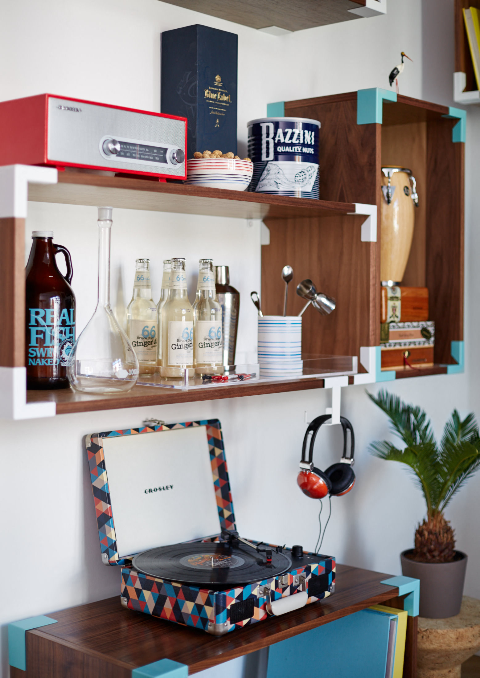 a shelf with a toaster on it and a laptop on a desk