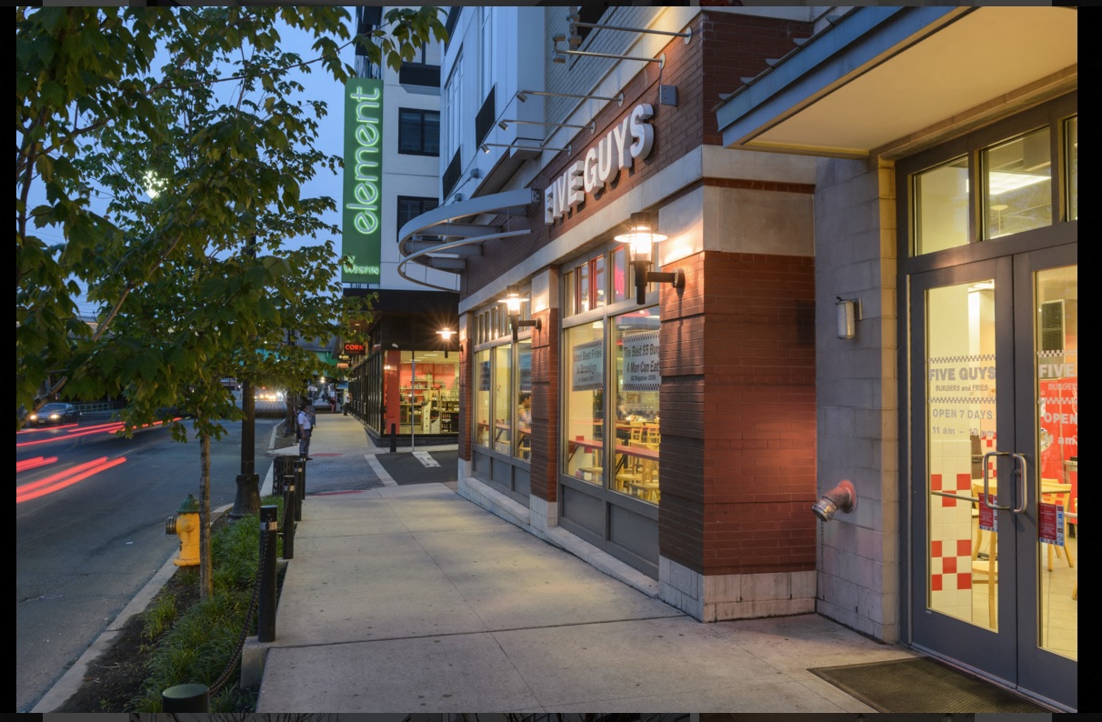 the outside of a store on a city street at night