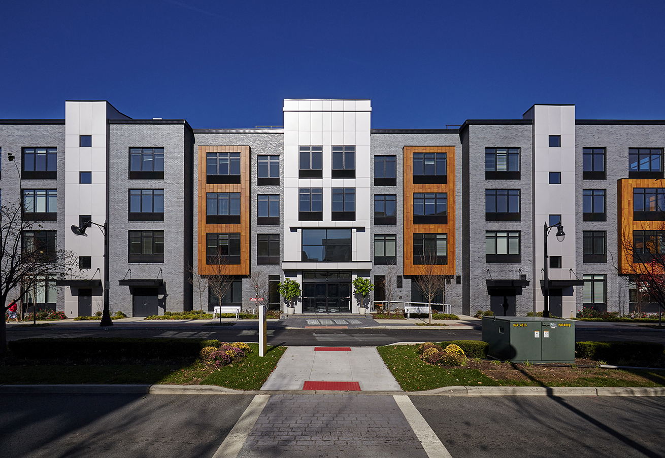 a row of modern apartment buildings on a city street