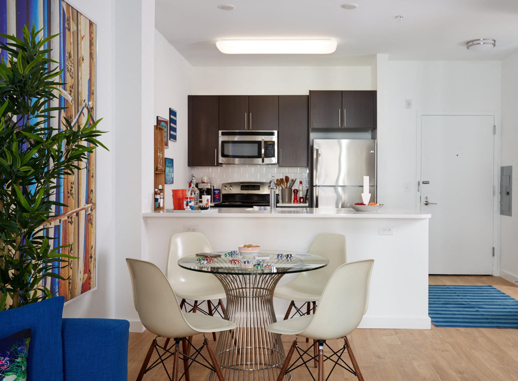 a kitchen and dining area with a round table and chairs