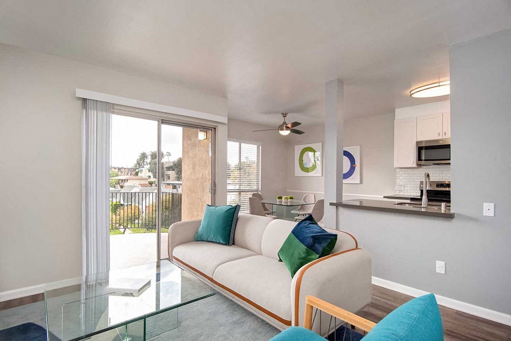 Glass Door, Sofa In Living Room at Los Robles Apartments, Pasadena, CA