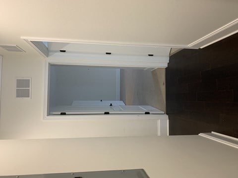 an open window in a kitchen with a sink