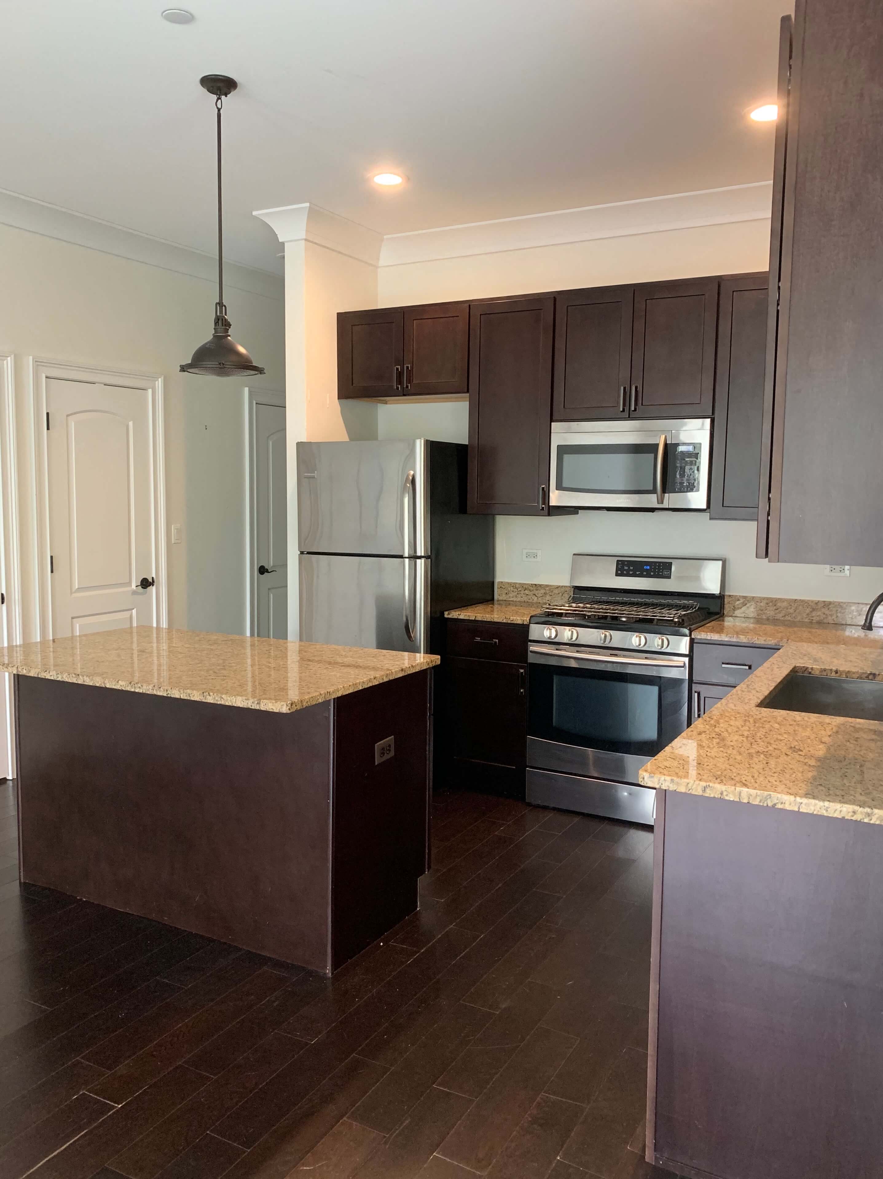 a kitchen with stainless steel appliances and a counter top