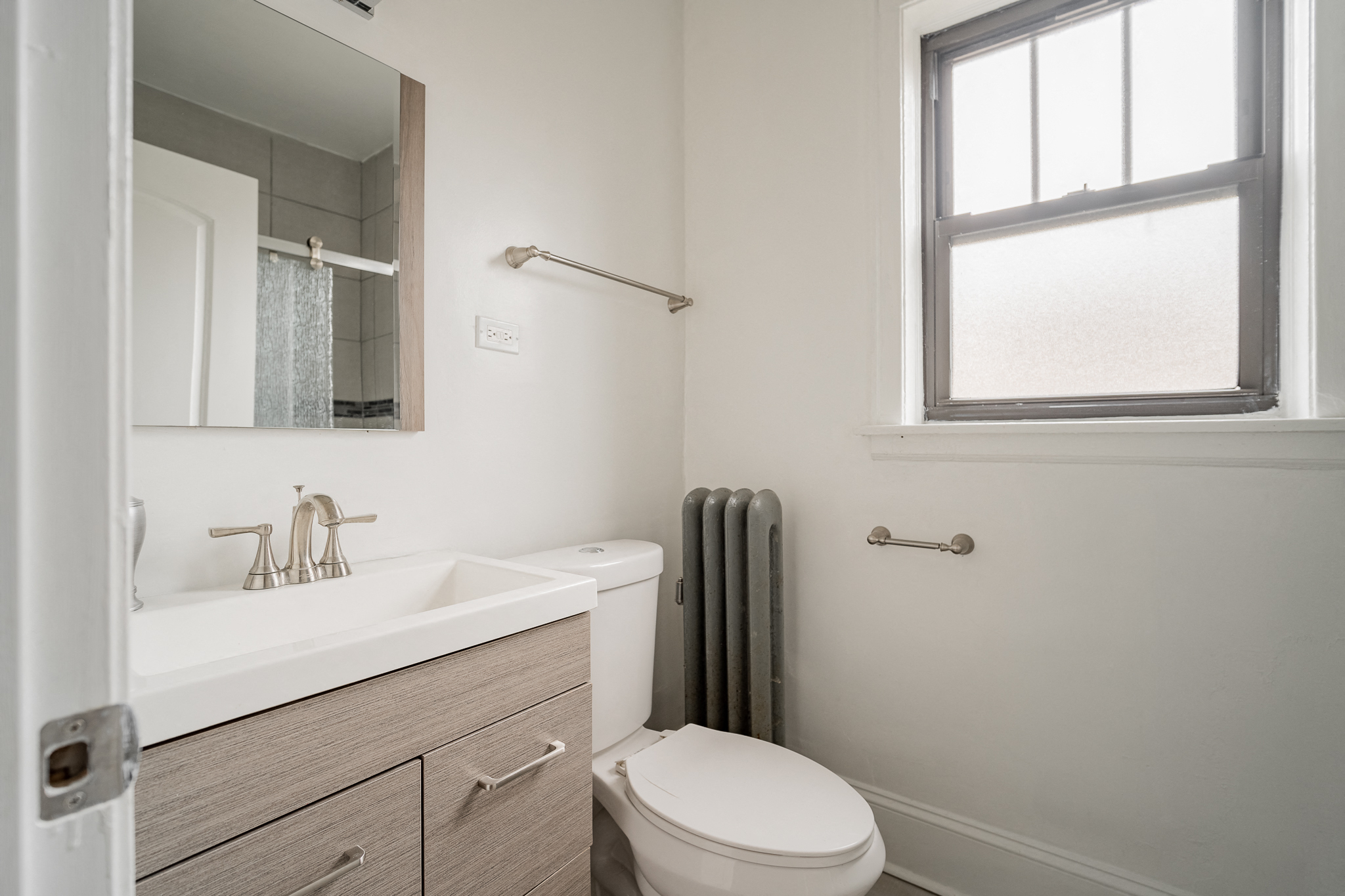 an empty bathroom with a toilet and a sink