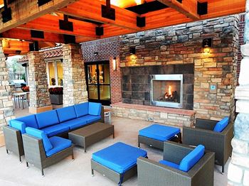 Short Term Rentals Longmont CO Outdoor Lounge by Pool with Seating and Fireplace