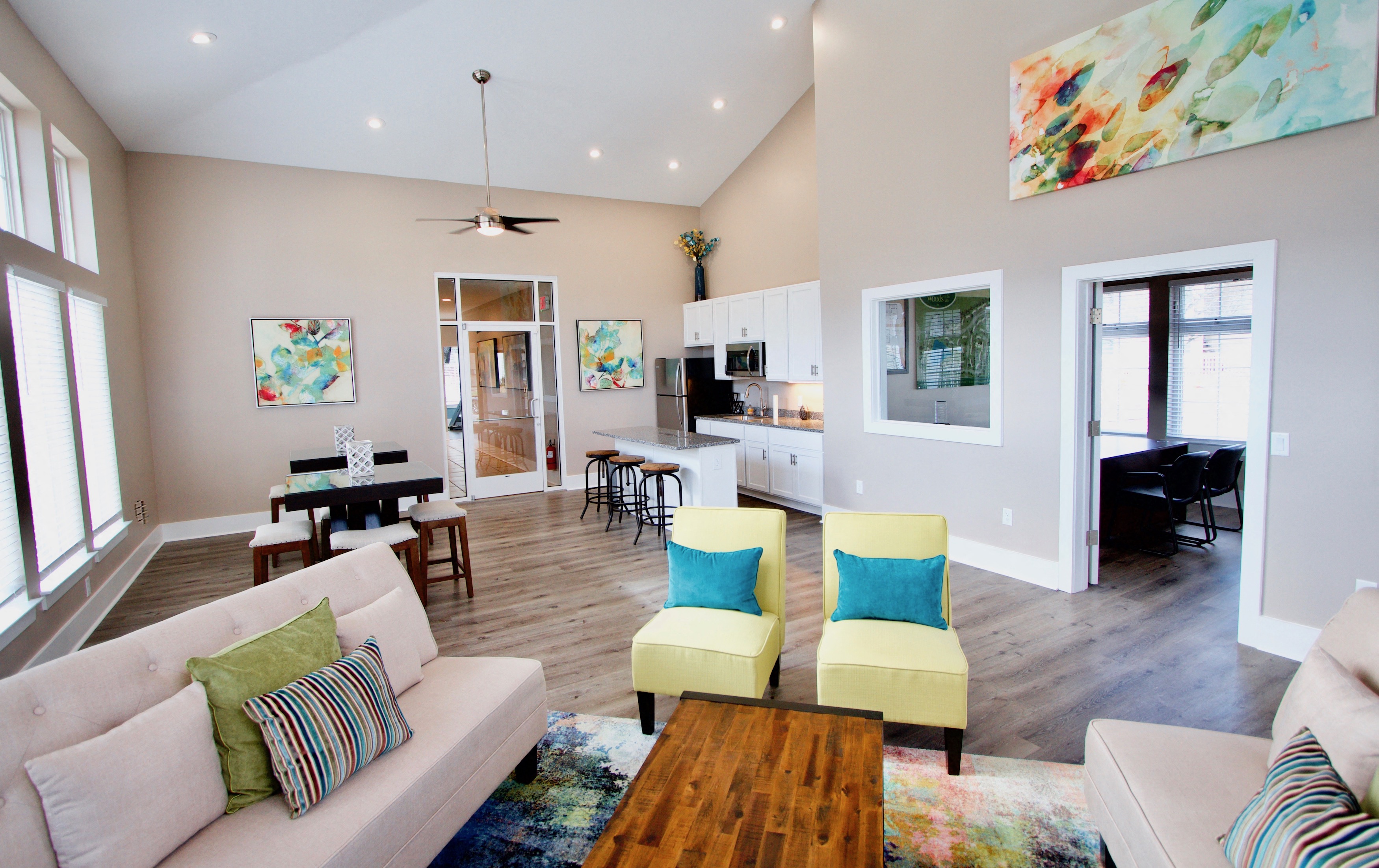 a living room with a couch and chairs and a table