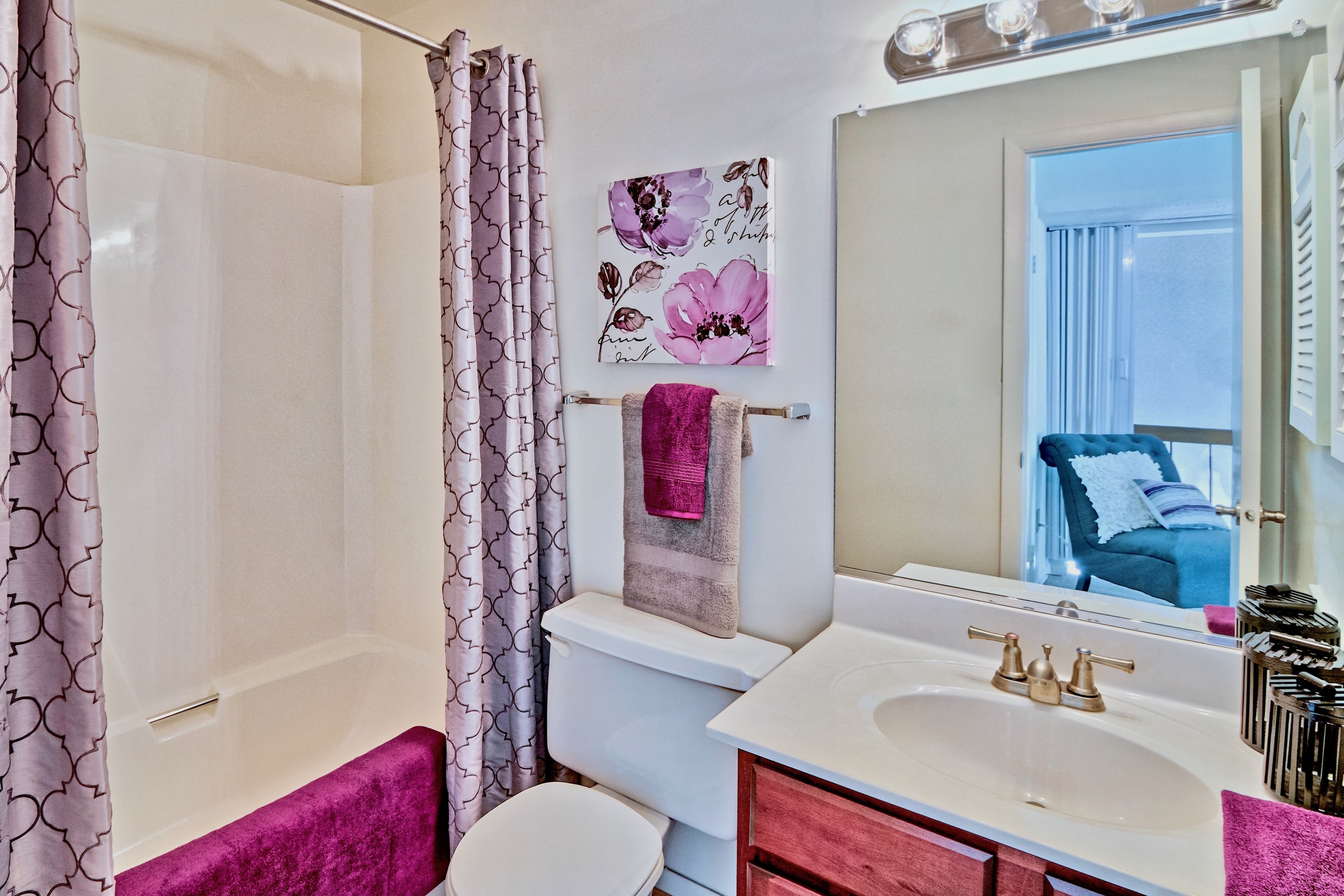 a bathroom with a sink and a mirror and a toilet