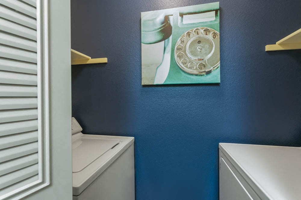 a bathroom with a picture of an old telephone on the wall