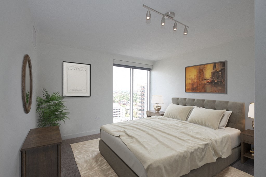 a bedroom with a large bed and a window