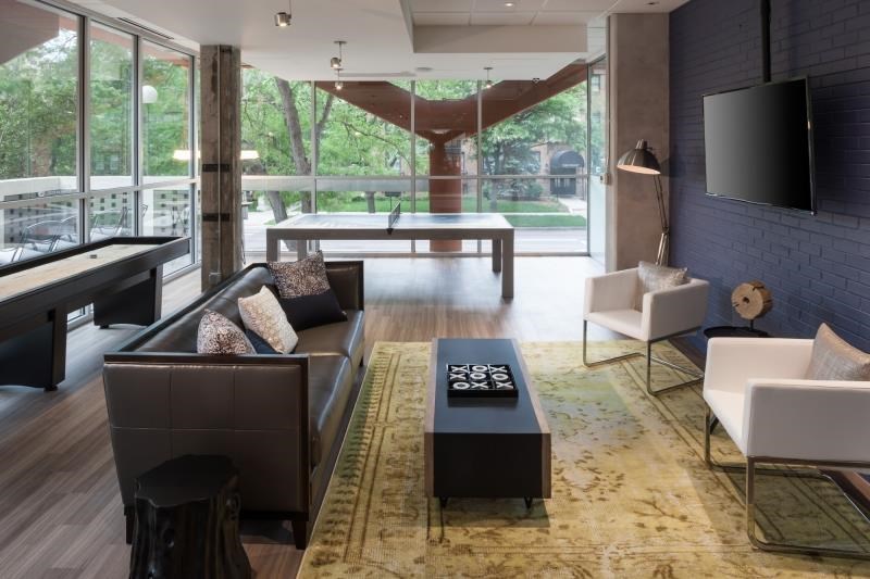 a living room with a couch and a table and a television