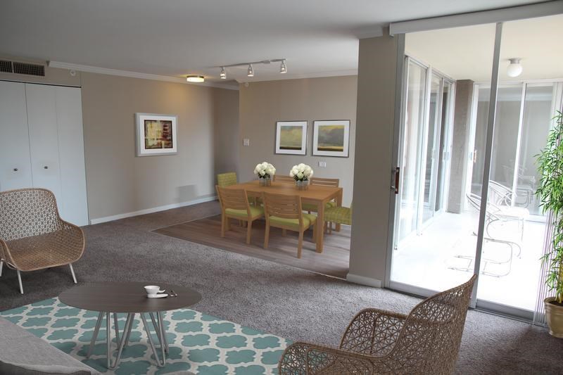 a dining room with a table and chairs