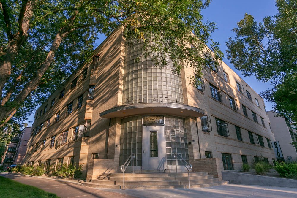 a large building with a tree in front of it