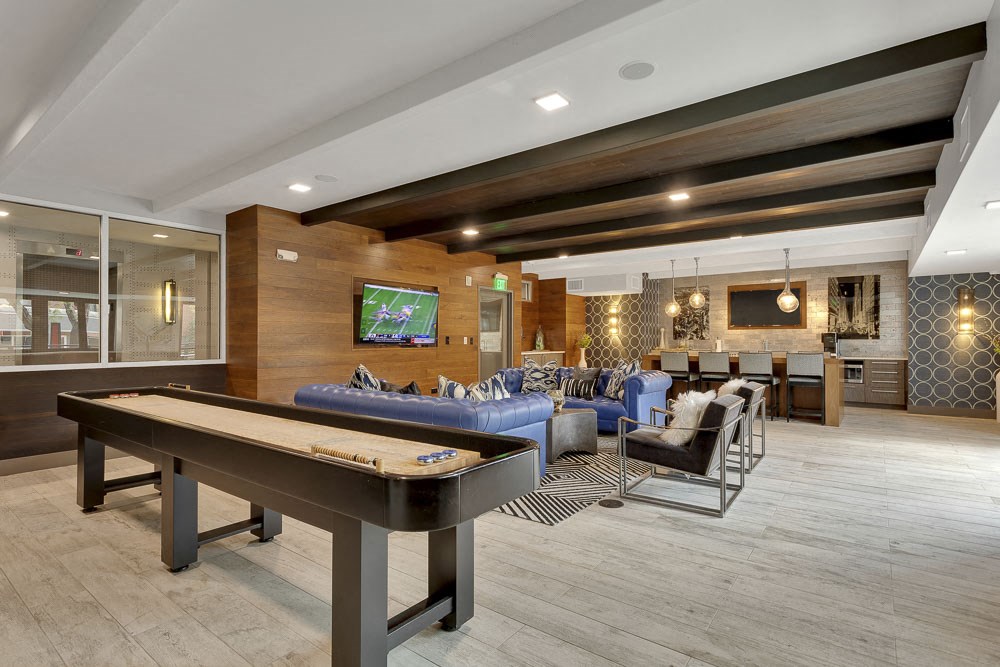 a game room with a pool table and a tv