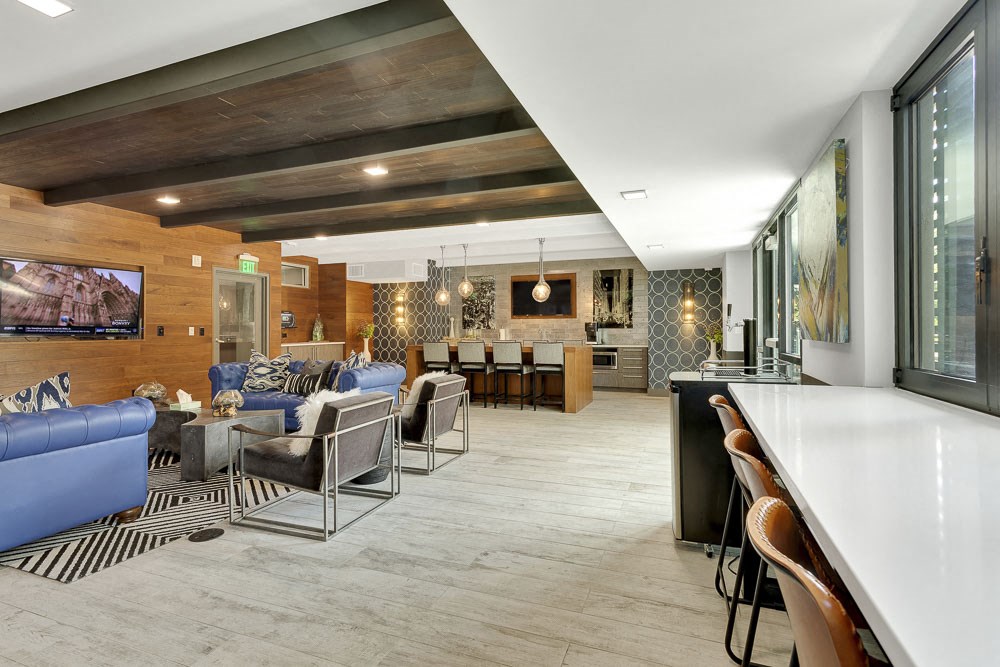 the lobby or reception area of a hotel with couches and chairs