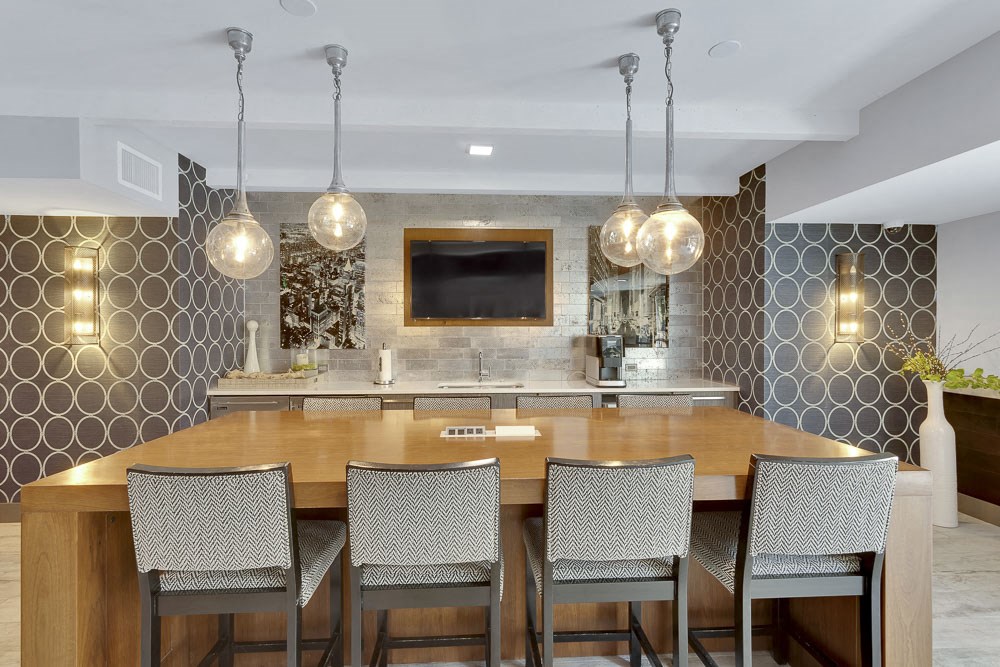 a kitchen with a wooden table and chairs