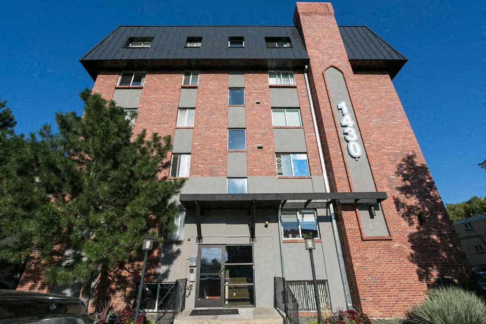 a brick building with a sign on the side of it