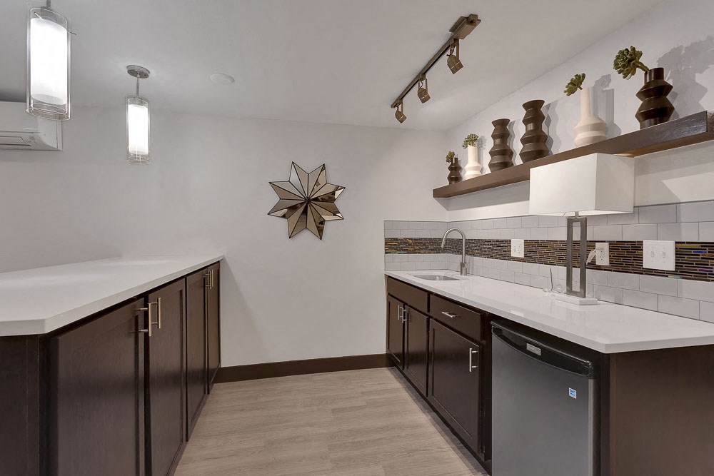 a kitchen with a sink and a counter top