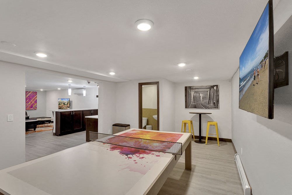 a room with a table with a painting on it