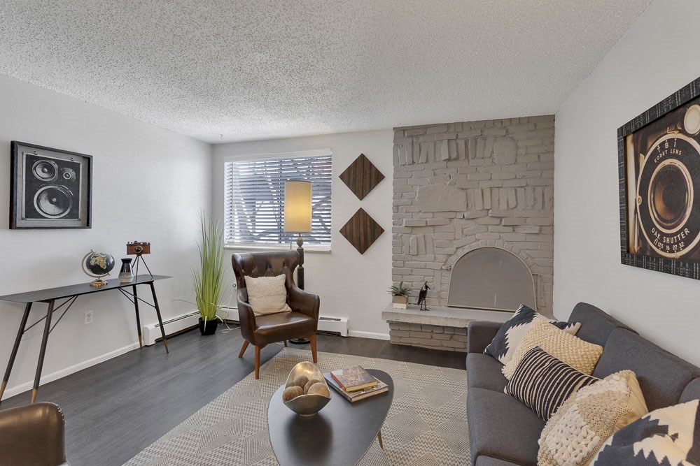 a living room with a fireplace and a couch