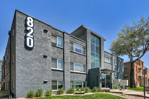 a brick building with a sign on the side of it