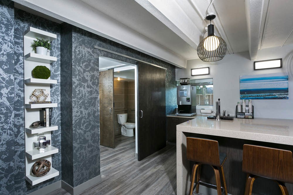 a kitchen or kitchenette with a counter and stools