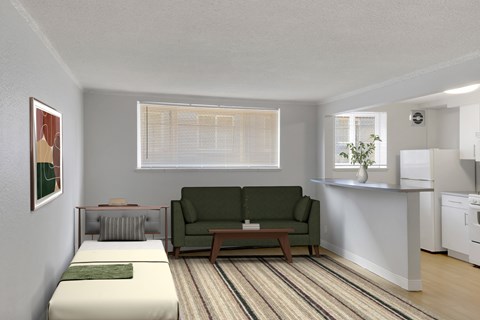 A living room with a green couch and a striped rug.