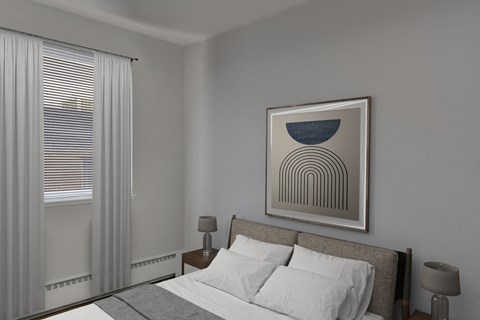 A bedroom with a bed, two lamps, and a framed picture on the wall.