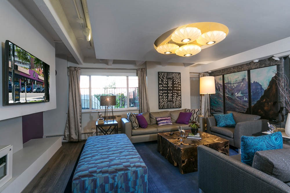 a living room with a couch and a tv