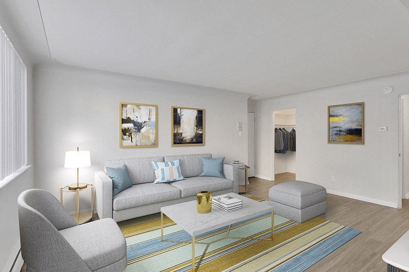 a living room with a couch and two chairs