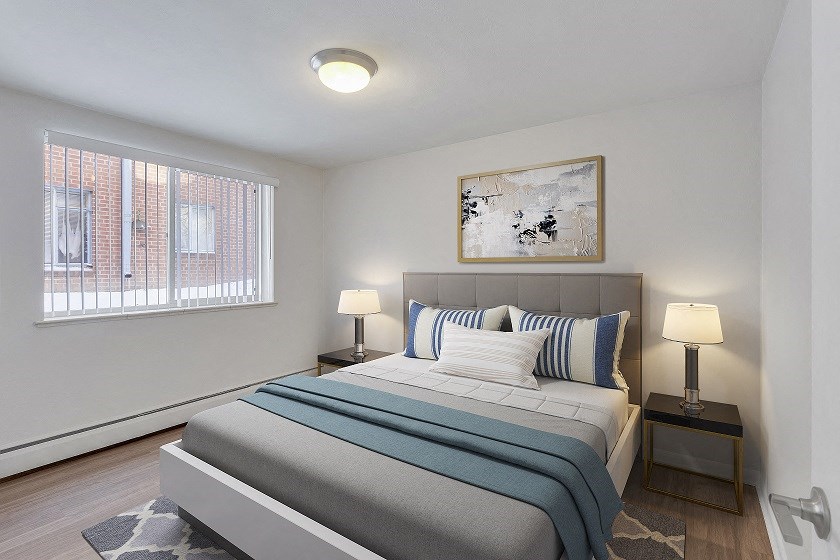 a bedroom with a bed and a window