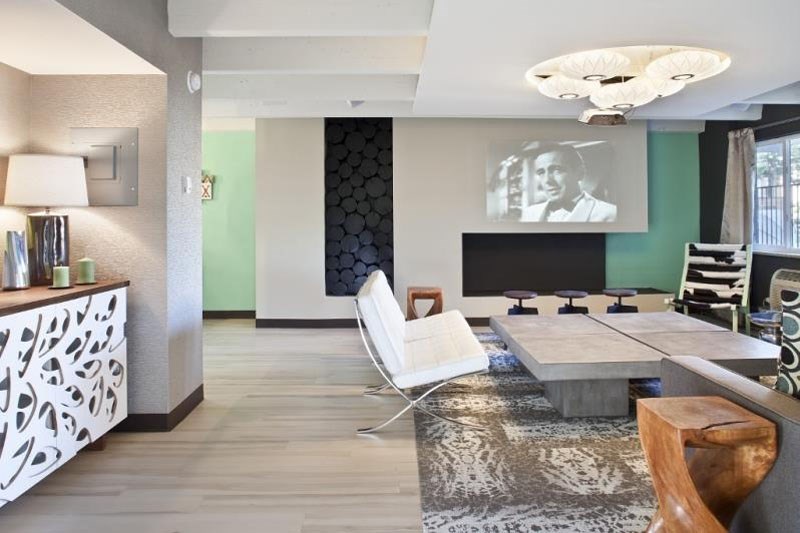 a living room with a couch and a table and a television