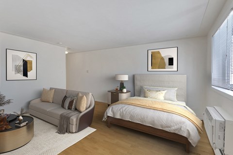 a bedroom with a bed and a couch