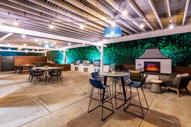 Outdoor grill and fireplace with seating