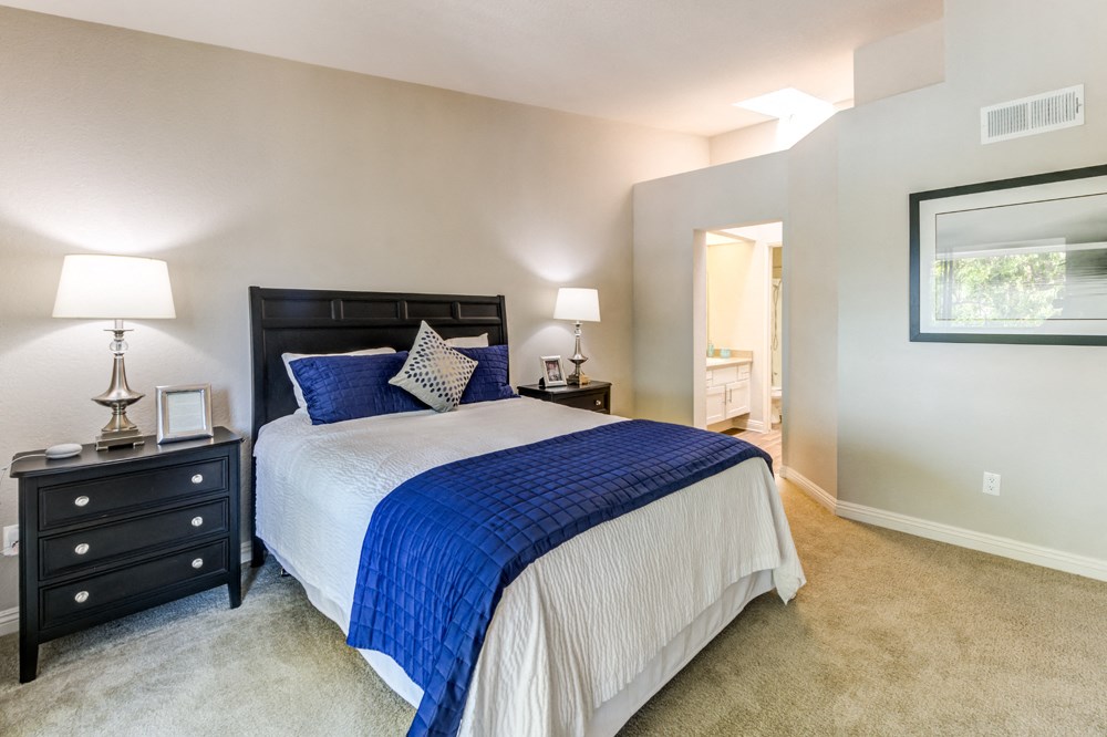 Two-Bedroom Apartments in Aliso Viejo, CA- Aliso Creek- Bedroom with Plush Carpeting and In-Suite Bathroom