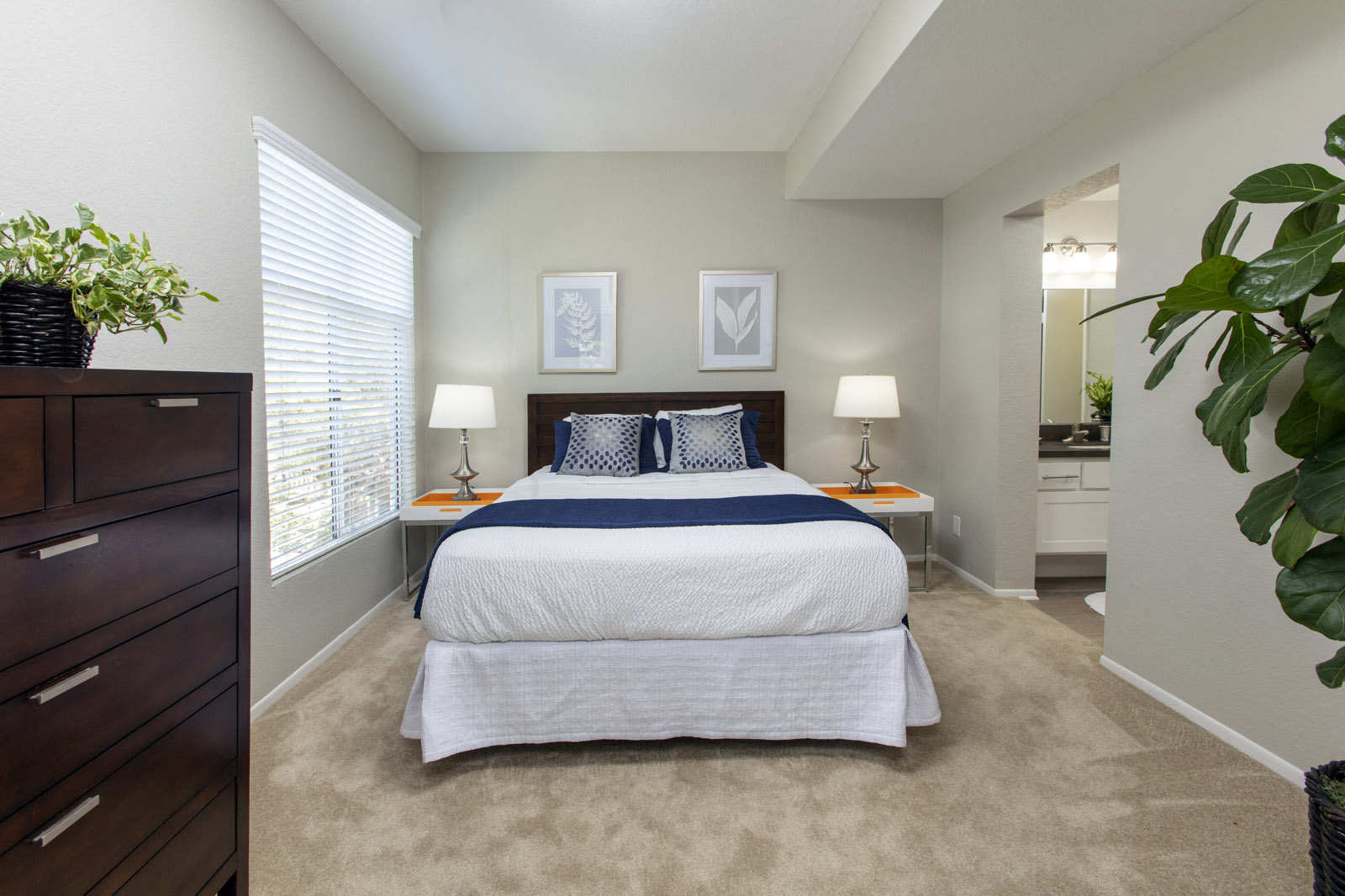 Bedroom with bathroom and window