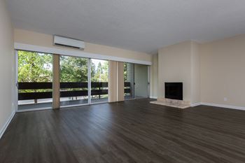 Wood Floor Living Room and a fireplace at Palo Alto Place, Palo Alto, CA