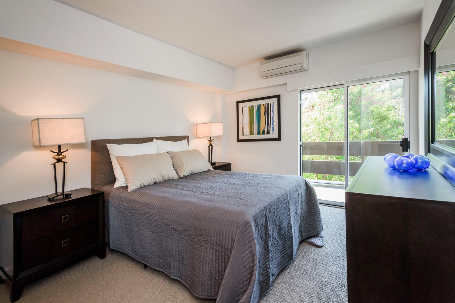 One Bedroom Apartments in Palo Alto, CA - Palo Alto Place - Furnished Bedroom with Plush Carpeting and Sliding Glass Door to Patio.