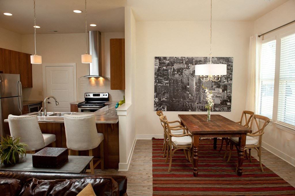 an open kitchen and dining room with a table and chairs