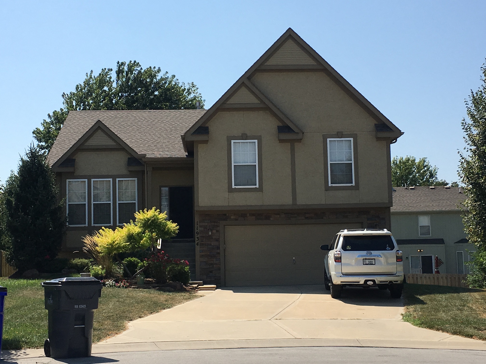 a house with a van parked in front of it