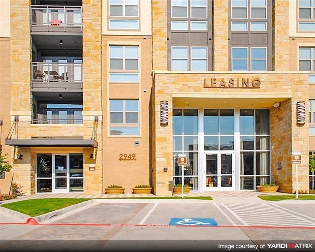 a building with a parking lot in front of it